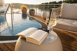 AMADEUS Nova Sun Deck. Pool Quality Time At The Outdoor Pool Of The AMADEUS Nova With A Book And A Simple Cocktail Lueftner Cruises Amadeus Internal